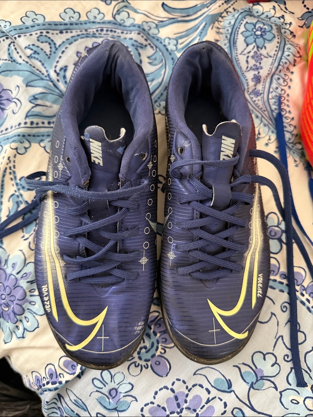 Nike Navy Blue Soccer Cleats with Yellow Swoosh
